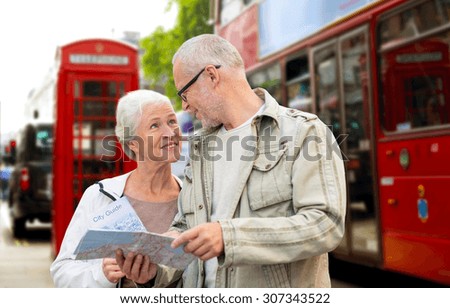 family, age, tourism, travel and people concept - senior couple with map over london city street background