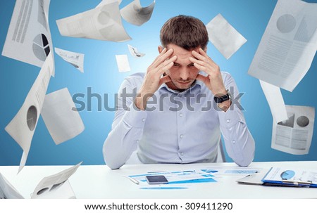 business, people, stress, deadline and technology concept - close up of businessman with smartphone and papers over blue background