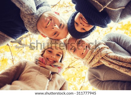 family childhood season and people concept happy family in autumn park family childhood season and people concept happy family in autumn park