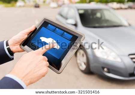transport, business trip, technology and people concept - close up of male hands with car icon tablet pc computer screen outdoors