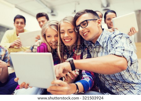 education, high school, technology and people concept - group of smiling students with tablet pc computers taking photo or video indoors
