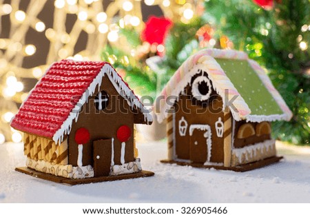 holidays, christmas, baking and sweets concept - closeup of beautiful gingerbread house on table