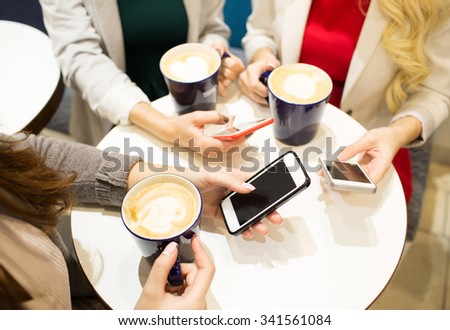 drinks, communication, leisure, technology and people concept - close up of hands with coffee cups and smartphones