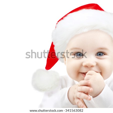 christmas, babyhood, childhood and people concept - happy baby in santa hat over white