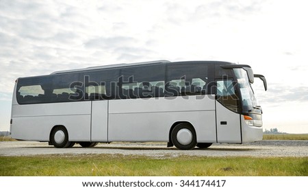 travel, tourism, road trip and passenger transport - tour bus driving outdoors