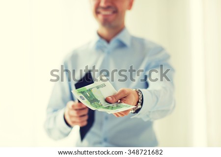 people, business, finances and money concept - close up of businessman hands holding open wallet with euro cash