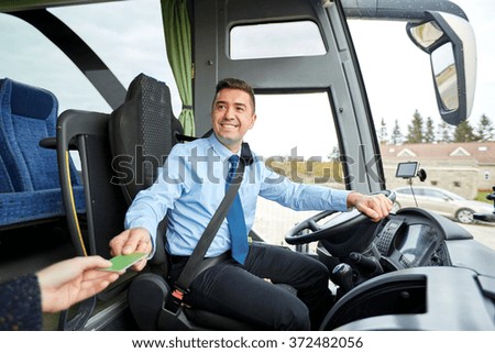 bus driver taking ticket or card from passenger