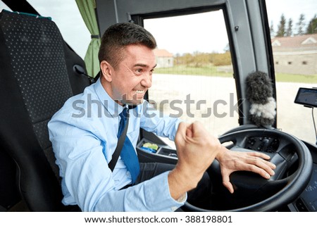 transport, tourism, gesture, emotion and people concept - angry driver showing fist and driving bus