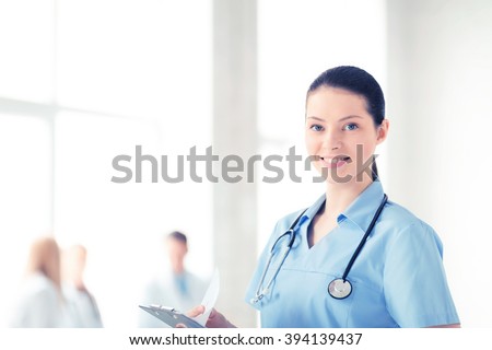 attractive female doctor or nurse in hospital