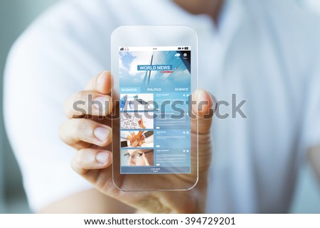 business, technology and people concept - close up of male hand holding and showing transparent smartphone with world news web page on screen