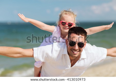 family, travel, vacation, adoption and people concept - happy father with little girl in sunglasses having fun on summer beach