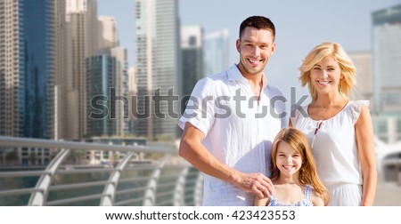 summer holidays, travel, tourism, vacation and people concept - happy family over dubai city street background