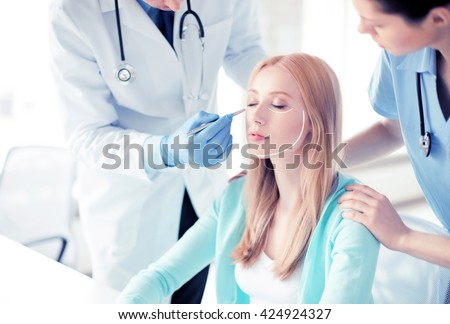 bright picture of male plastic surgeon with patient