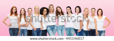 friendship, diversity, body positive and people concept - group of happy women of different age size and ethnicity in white t-shirts hugging over pink background