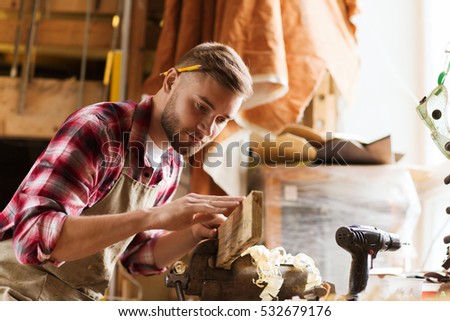 profession, carpentry, woodwork and people concept - carpenter testing wood plank evenness at workshop