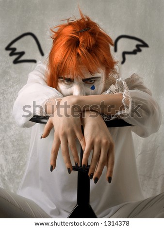 Clown Makeup on Sad Girl In Clown Makeup With Painted Wings Stock Photo 1314378