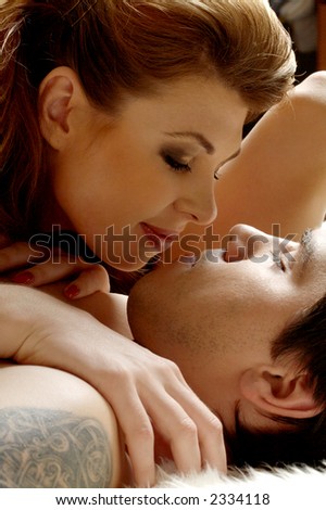 picture of sweet couple cuddling in bed