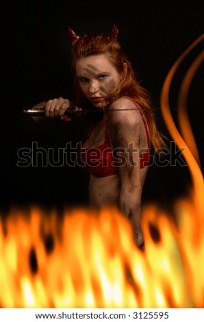 dark red devil girl with a knife in burning fire