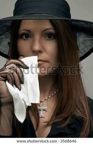 stock photo : crying christian lady in black funeral dress