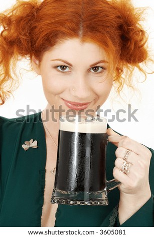 stock-photo-redhead-in-green-dress-with-a-mug-of-irish-stout-beer-3605081.jpg