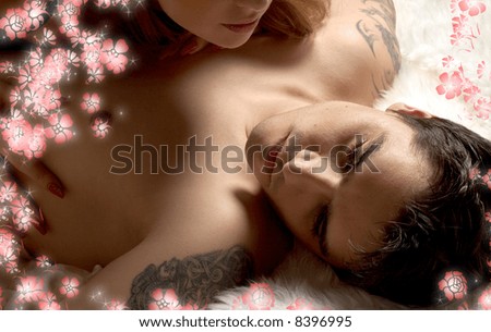 portrait of tired married man in bed with wife and flowers