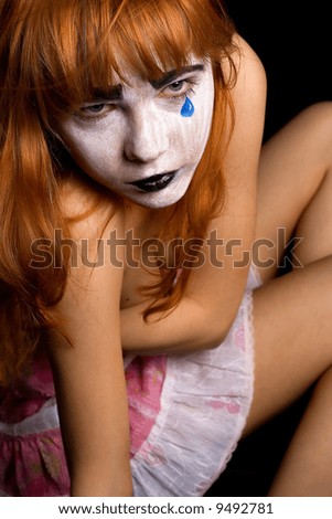 sad clown-face makeup girl