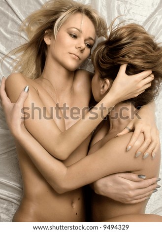 stock photo sepia toned image of two naked girls cuddling