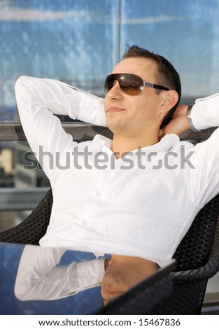 picture of handsome man relaxing in chair