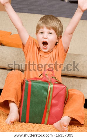 picture of happy boy with big gift box