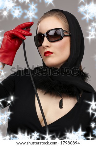 portrait of lady in black headscarf and red gloves with crop