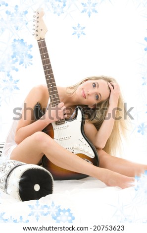 lovely blonde with electric guitar and snowflakes