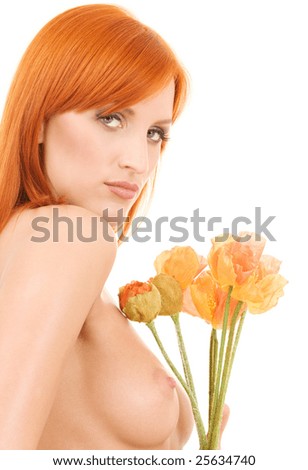 stock photo picture of topless redhead with flowers over white