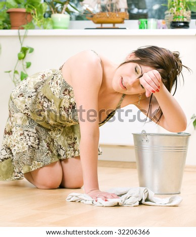 bright picture of lovely housewife cleaning floor