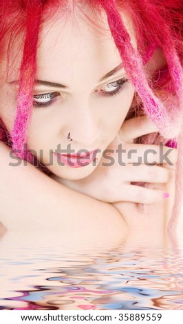 picture of sad pink hair girl in water