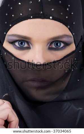 closeup picture of ninja face in the dark