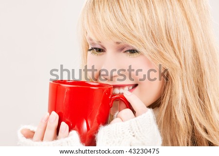 picture of happy teenage girl with red mug