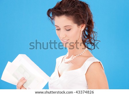 happy bride with money and envelopes over blue