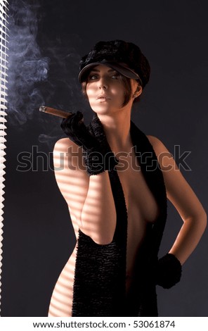 stock-photo-sexy-woman-in-black-astrakhan-smoking-cigar-53061874.jpg