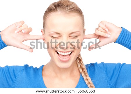 picture of smiling woman with fingers in ears