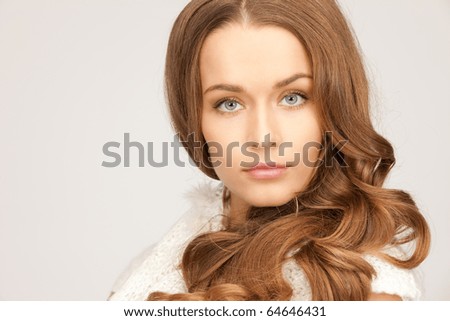 picture of beautiful woman in white comforter