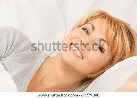bright closeup picture of  woman in bed