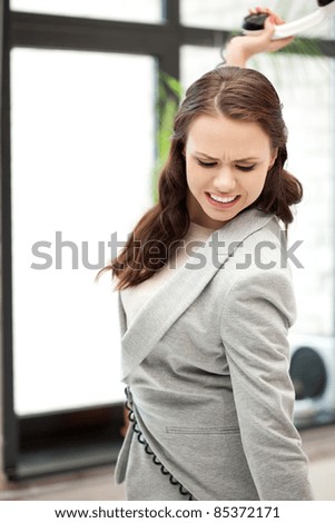 bright picture of angry businesswoman with phone