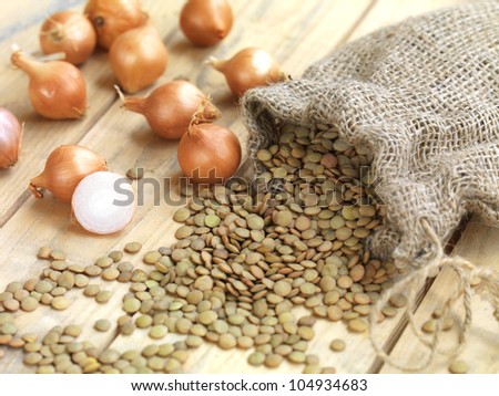 lentils and small onions spead on a vintage table