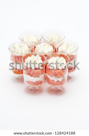 strawberry cake and cream desserts in a small glass