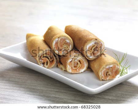 pancake rolls filled with feta cream cheese,smoked fish and herbs