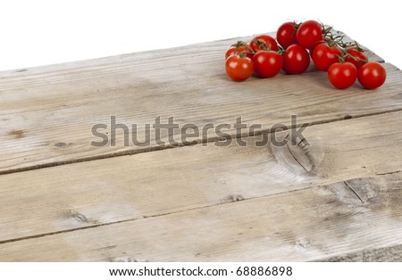 cherry tomatoes on a wooden surface