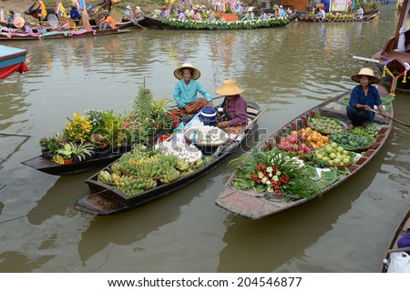 AYUTTHAYA, THAILAND - JULY 11: Beautiful flower boats in floating parade, the unique annual candle festival of Buddhist lent on July 11, 2014  in Ladchado, Ayutthaya, Thailand
