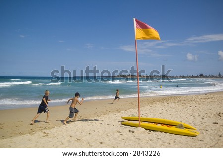 view of an australian beach scene with surf life saving flag