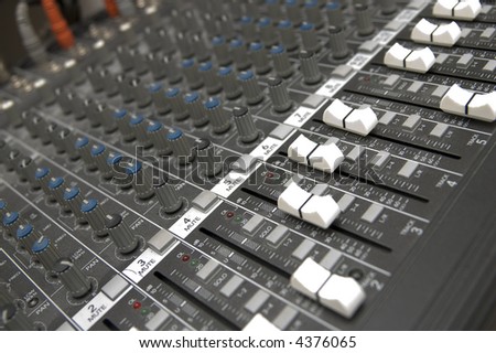 closeup view of a DJ\'s mixing desk