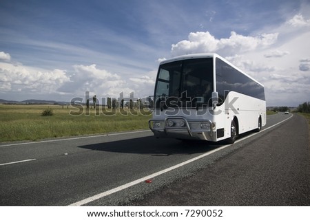 tourist bus traveling down a major highway